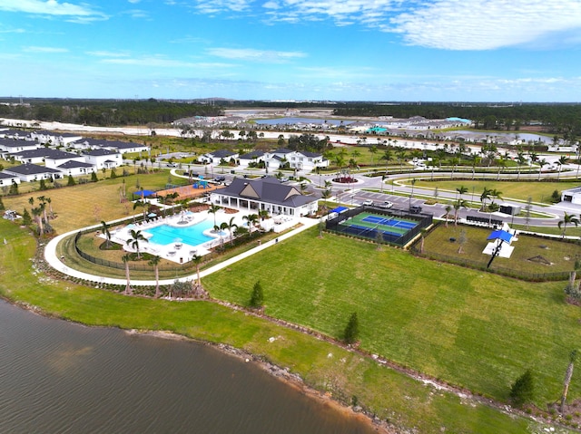 birds eye view of property with a water view