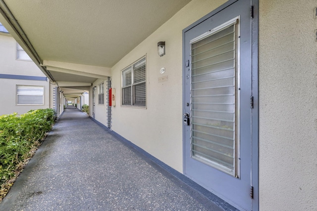 property entrance featuring stucco siding