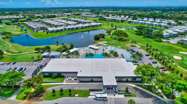 birds eye view of property featuring view of golf course and a water view