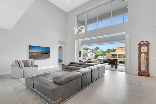 living room featuring a towering ceiling