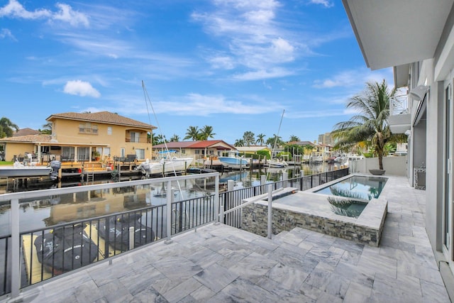 view of patio / terrace featuring a water view