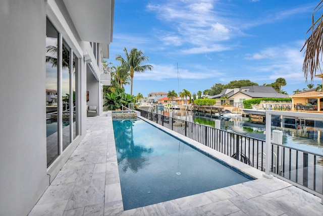 view of pool with a water view