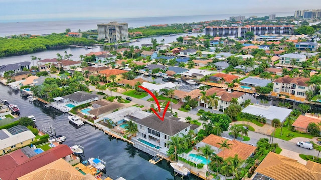 birds eye view of property with a water view