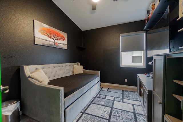 bedroom with ceiling fan and lofted ceiling