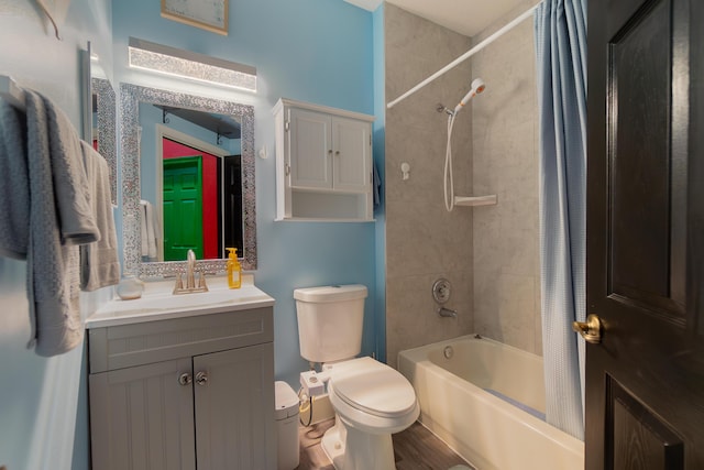 full bathroom with vanity, toilet, and shower / bath combo with shower curtain