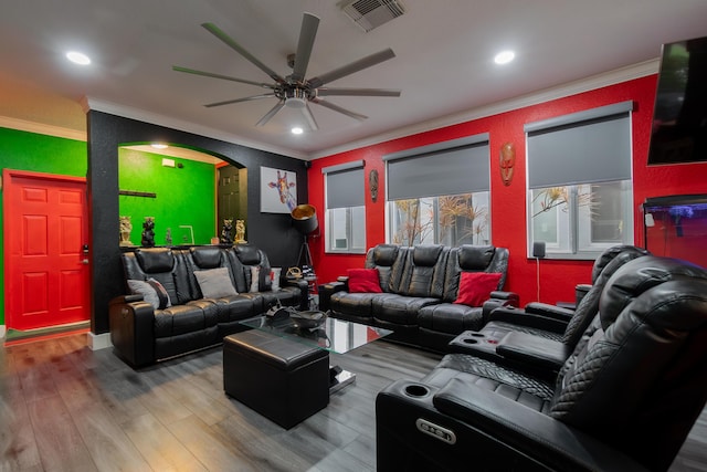 living room with visible vents, ceiling fan, ornamental molding, wood finished floors, and recessed lighting