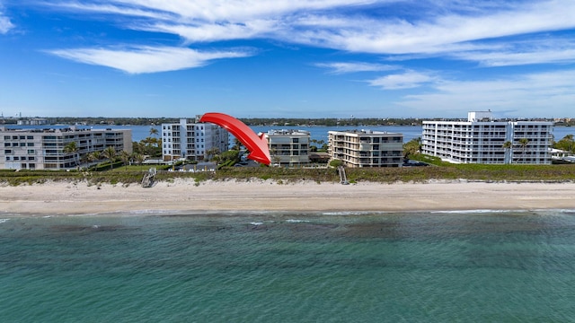 bird's eye view with a view of the beach and a water view