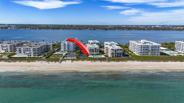 aerial view featuring a view of the beach and a water view