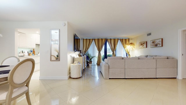 living room with light tile patterned flooring