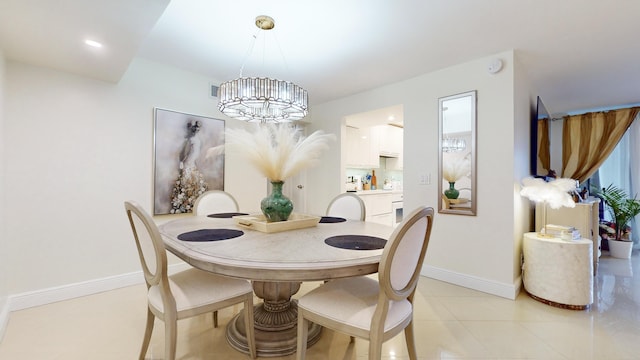 tiled dining room featuring a notable chandelier