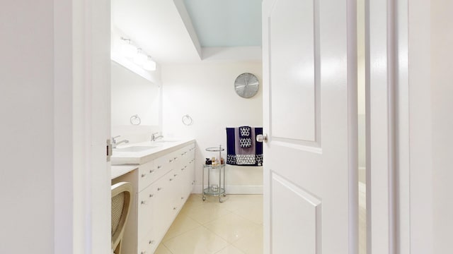 bathroom with tile patterned flooring and vanity