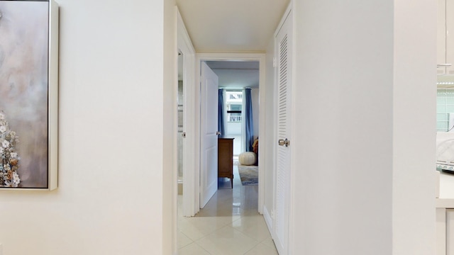 hallway with light tile patterned floors