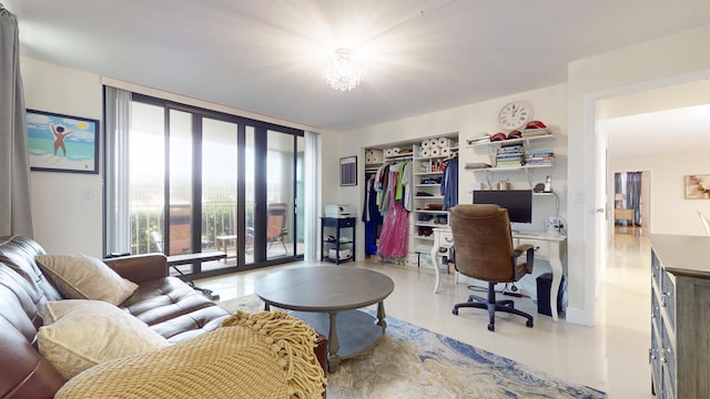 office area with a notable chandelier and a wall of windows