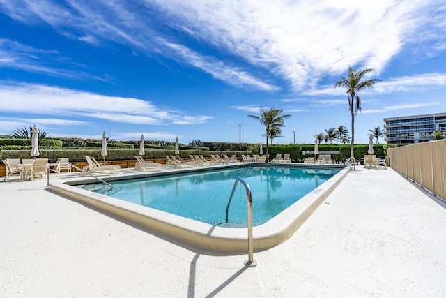 view of swimming pool with a patio area