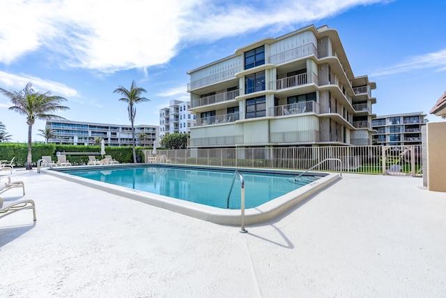 view of swimming pool with a patio area