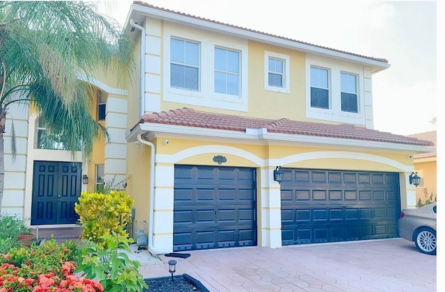 view of front of home with a garage