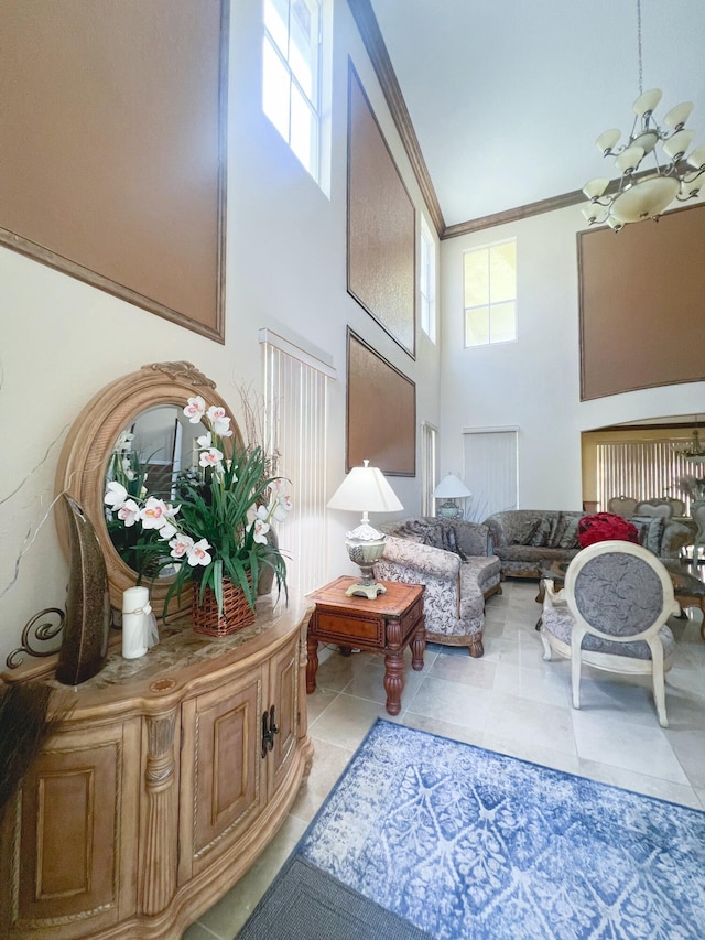 interior space featuring an inviting chandelier, light tile patterned floors, a towering ceiling, and crown molding