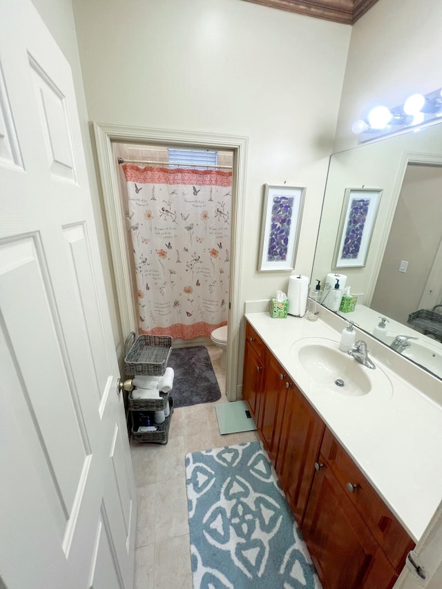 bathroom featuring vanity, curtained shower, tile patterned floors, and toilet