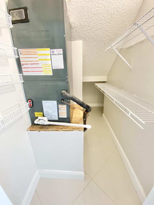 walk in closet featuring tile patterned flooring