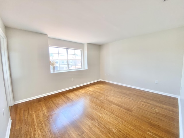 empty room with light wood-type flooring