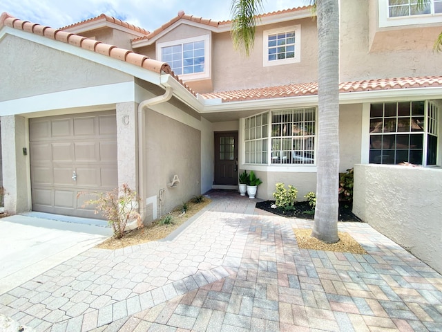 property entrance with a garage