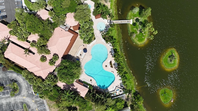 birds eye view of property with a water view