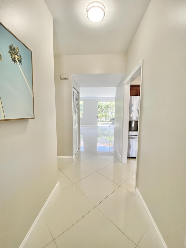 hall with light tile patterned flooring