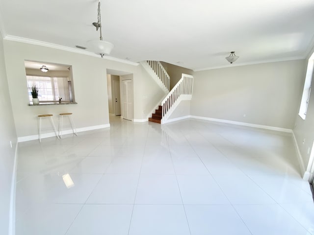 tiled spare room with crown molding