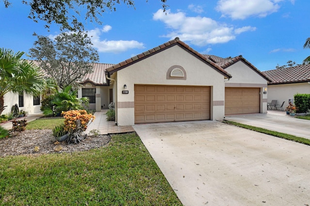 mediterranean / spanish house featuring a garage