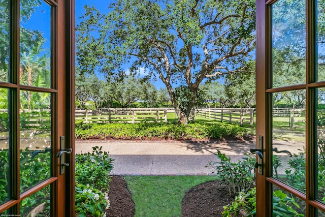 view of yard featuring a rural view and a patio area