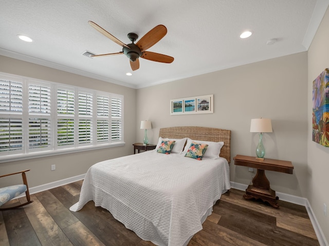 bedroom featuring crown molding, dark wood-type flooring, and ceiling fan