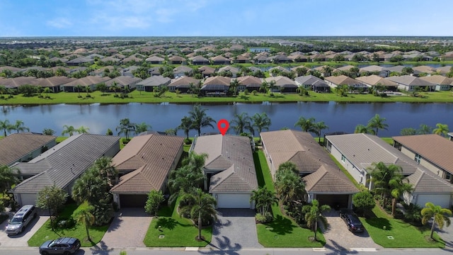 birds eye view of property featuring a water view