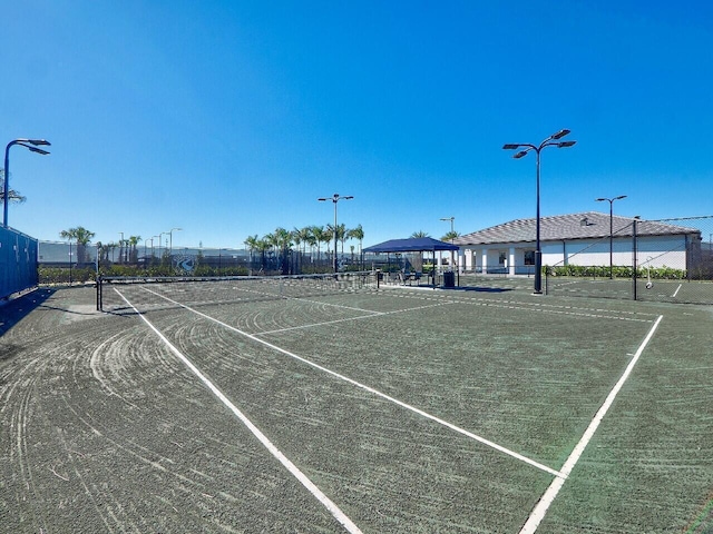 view of tennis court featuring a gazebo