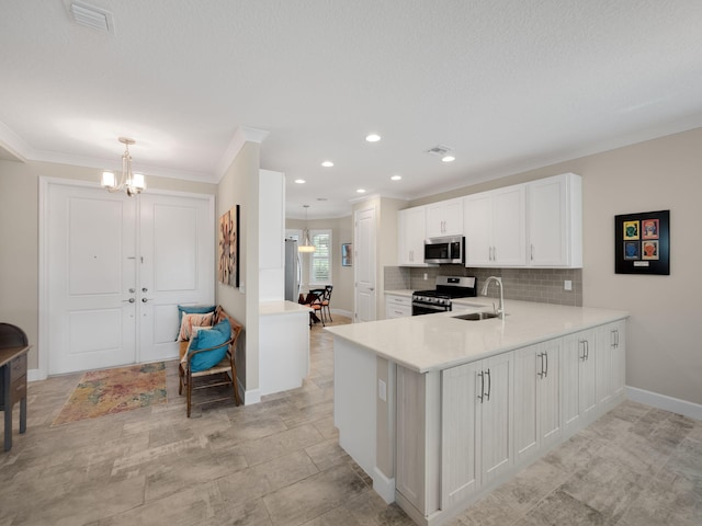 kitchen with sink, kitchen peninsula, pendant lighting, stainless steel appliances, and white cabinets