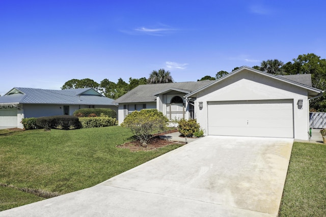 ranch-style house featuring a garage and a front lawn