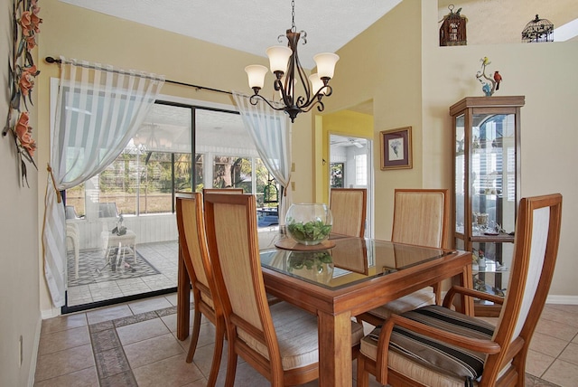 tiled dining area with an inviting chandelier