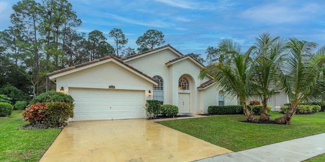 view of front of property featuring a garage and a front yard