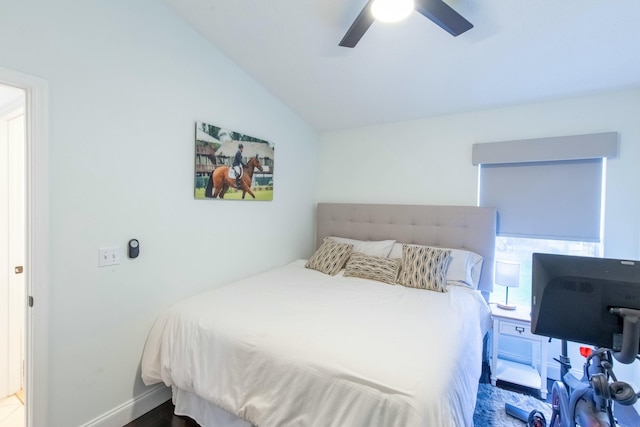 bedroom featuring ceiling fan, lofted ceiling, and hardwood / wood-style floors