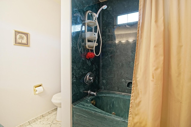 bathroom featuring toilet and shower / bath combo with shower curtain