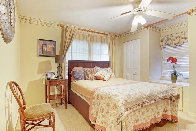 carpeted bedroom featuring ceiling fan