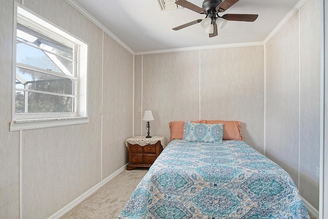 carpeted bedroom featuring ornamental molding and ceiling fan