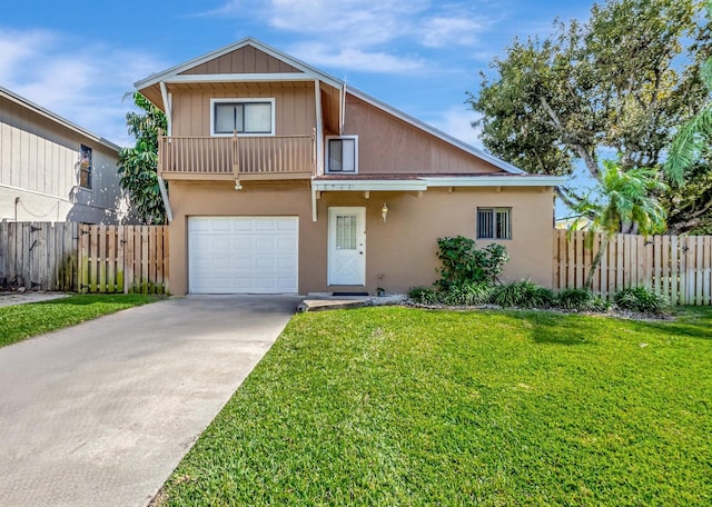 view of front of property with a garage and a front lawn