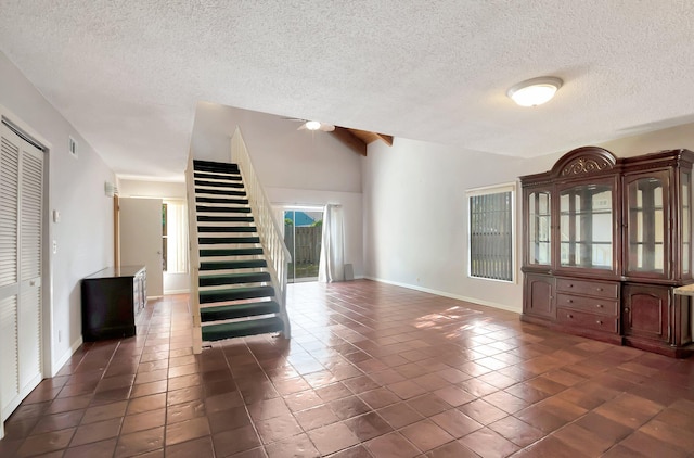 interior space featuring lofted ceiling and a textured ceiling