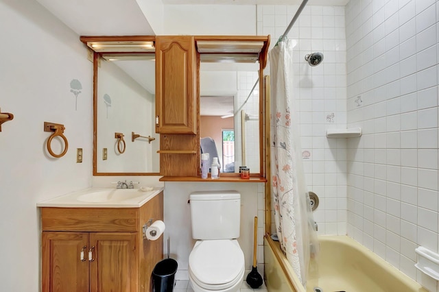 full bathroom with vanity, shower / tub combo with curtain, and toilet