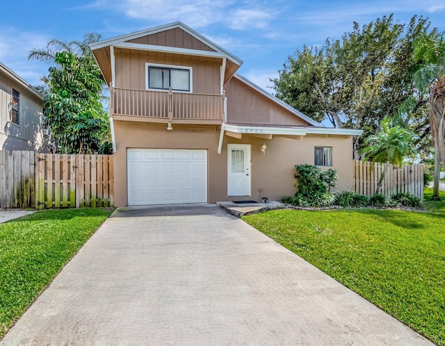 view of front of house with a garage and a front lawn