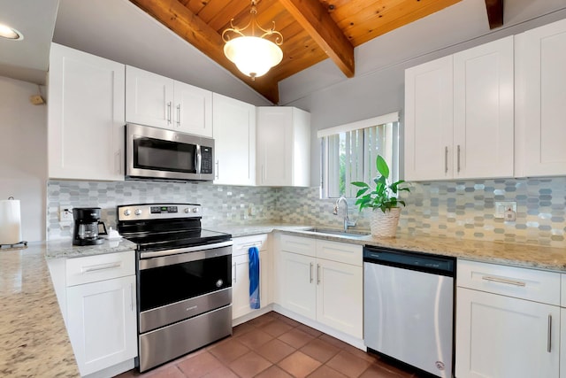 kitchen featuring sink, appliances with stainless steel finishes, white cabinetry, backsplash, and light stone counters