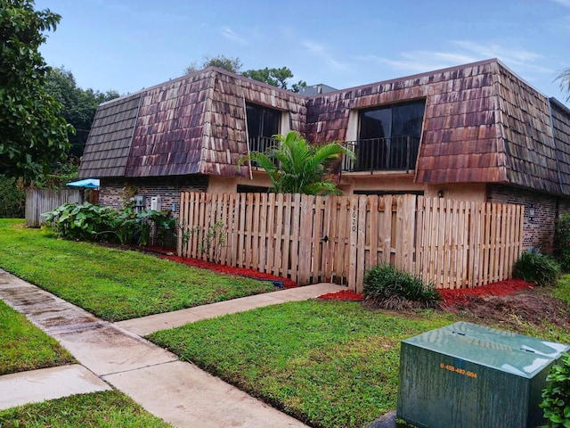 view of home's exterior with a yard