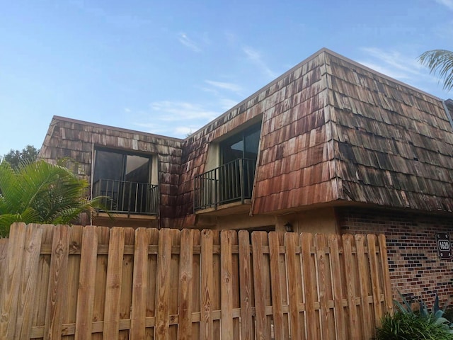 view of home's exterior with a balcony