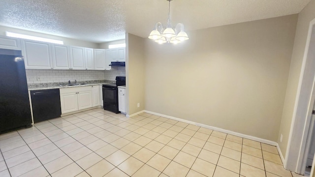 kitchen with tasteful backsplash, sink, white cabinets, and black appliances