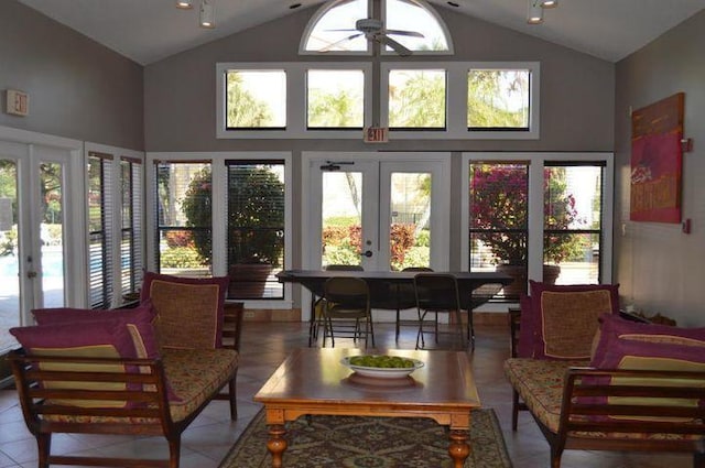 sunroom / solarium with french doors, ceiling fan, and vaulted ceiling